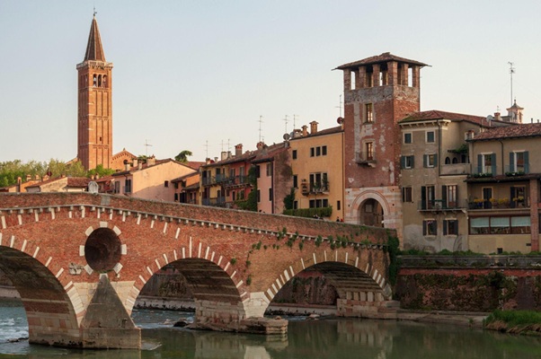 Historic stone bridge over the river at Ponte Pietra in Verona on an easy day trip from Milano Centrale train