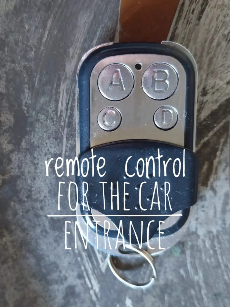 Close-up of the remote for the car entrance, provided to international tourists and travelers for their rental stay in Milan with Townhomes Milano.