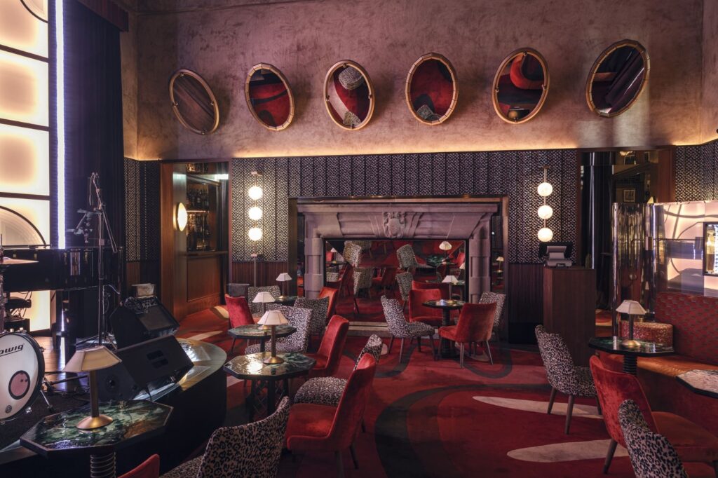 Elegant and moody interior of Rumore bar in Milan's Portrait Milano Hotel, showcasing the sophisticated aperitivo atmosphere and luxury decor of the Quadrilatero della Moda.