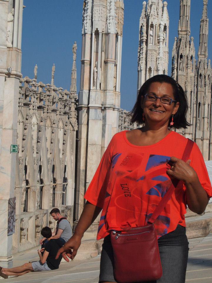 Tourist exploring the rooftop spires of Duomo di Milano, a must-visit landmark for a local perspective of the city.