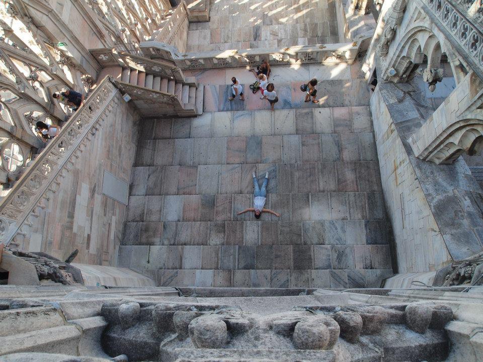 Unique top-down view of the marble terraces atop the Milan Cathedral, showcasing the historic architecture and tourist experience.